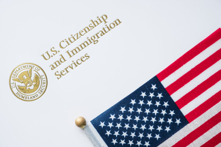 a document that says u.s citizenship and immigration sevrices with the flag next to it. representing the concept of the fy2025 H-1B- lottery for foreign workers