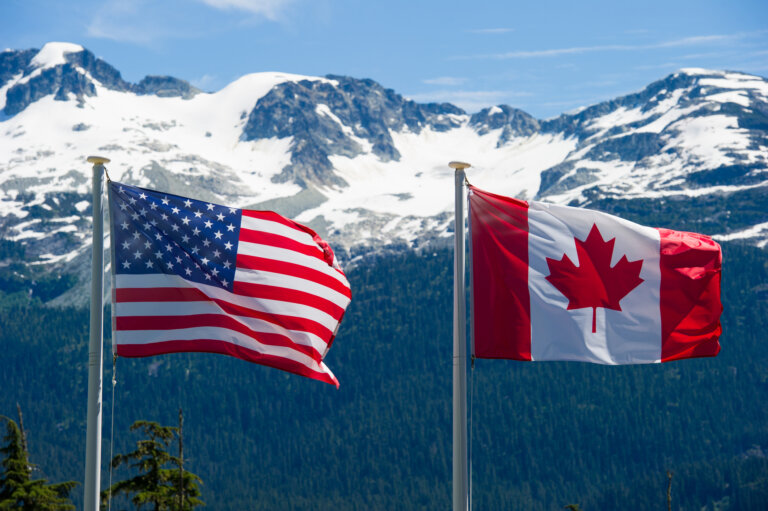 the canadian flag and the american flag next to each other representing tn work permit