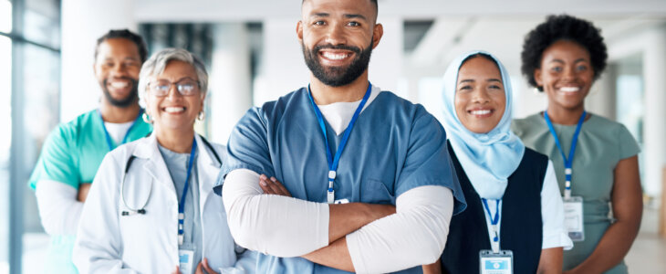 Healthcare, portrait and team of doctors in the hospital standing after a consultation or surgery. Success, confidence and group of professional medical workers in collaboration at a medicare clinic.